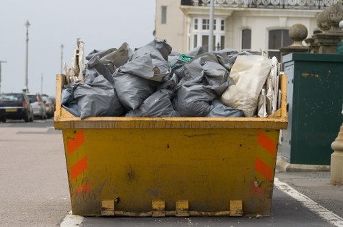 Low-emission van loading garden waste for transfer to recovery centre